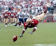 PETER WARRICK PIM 010  PETER WARRICK of Florida State dives to catch a football during a NCAA game. - PhotosinMotion.net. : PETER WARRICK diving for football picture, PETER WARRICK of Florida State photography, NCAA football photos, College Football photography, PhotosinMotion.net